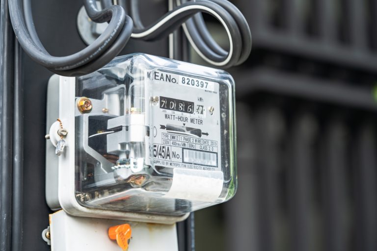 Electric measuring power meter for energy cost at home and office.